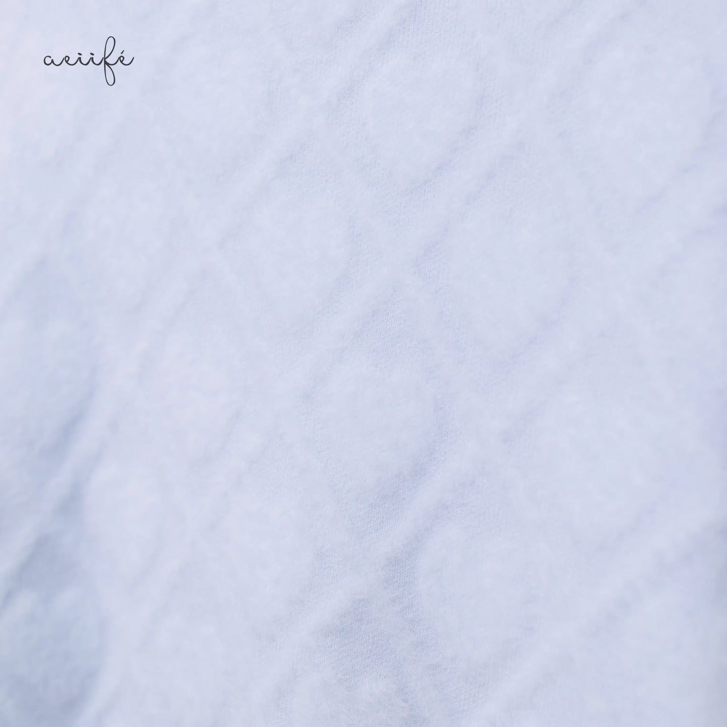 線條菱格絨感針織上衣